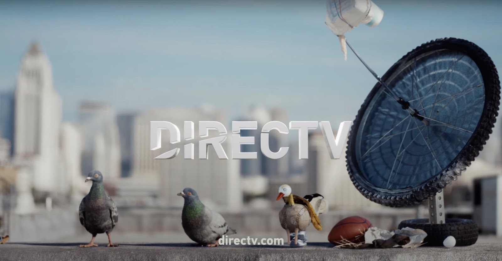 DirecTV sign on roof with antenna and doves